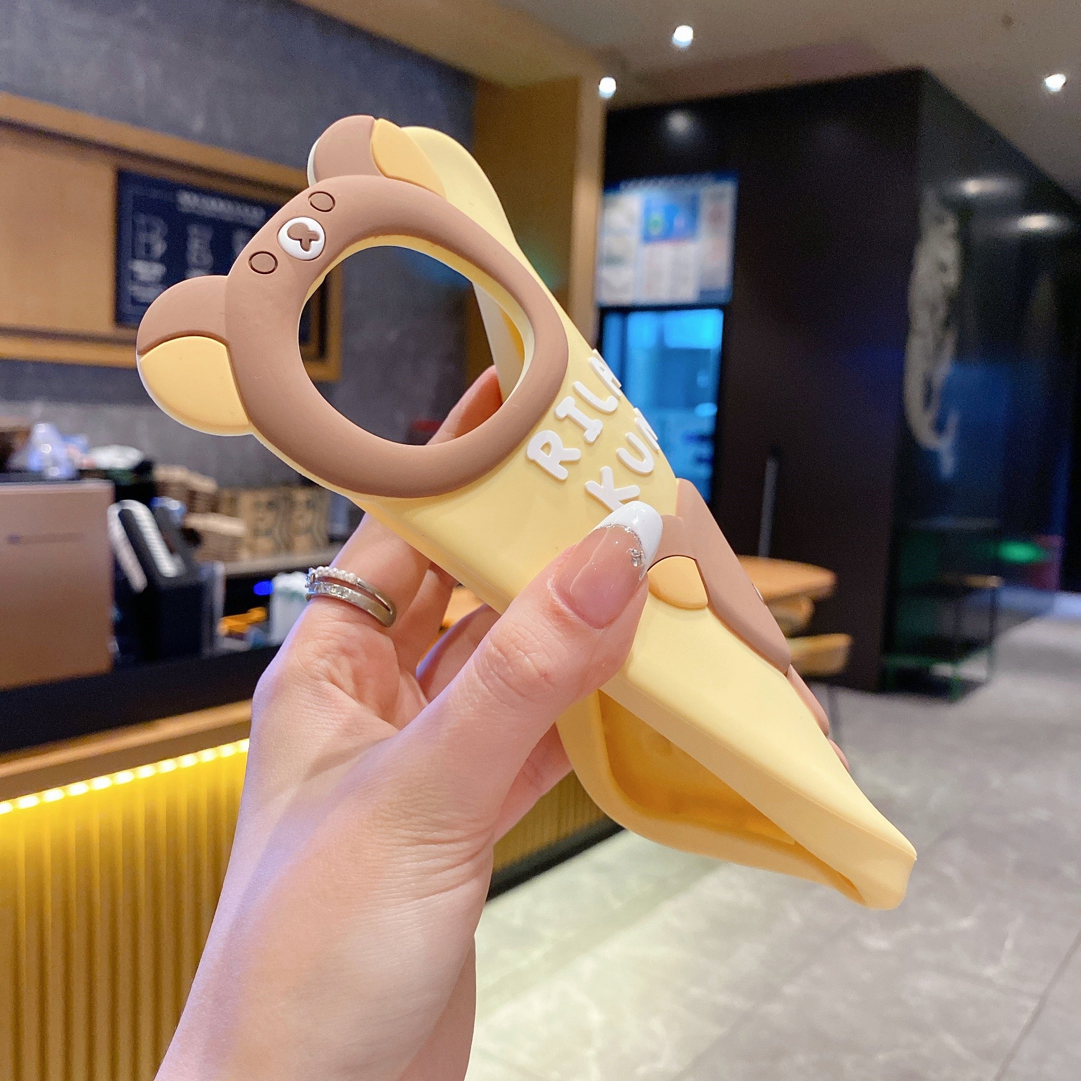 Yellow Lovely Chik Rilakkuma Bear Lens Frame Silicon Phone Cases For iPhone 14 Plus (Universal Camera Cut)